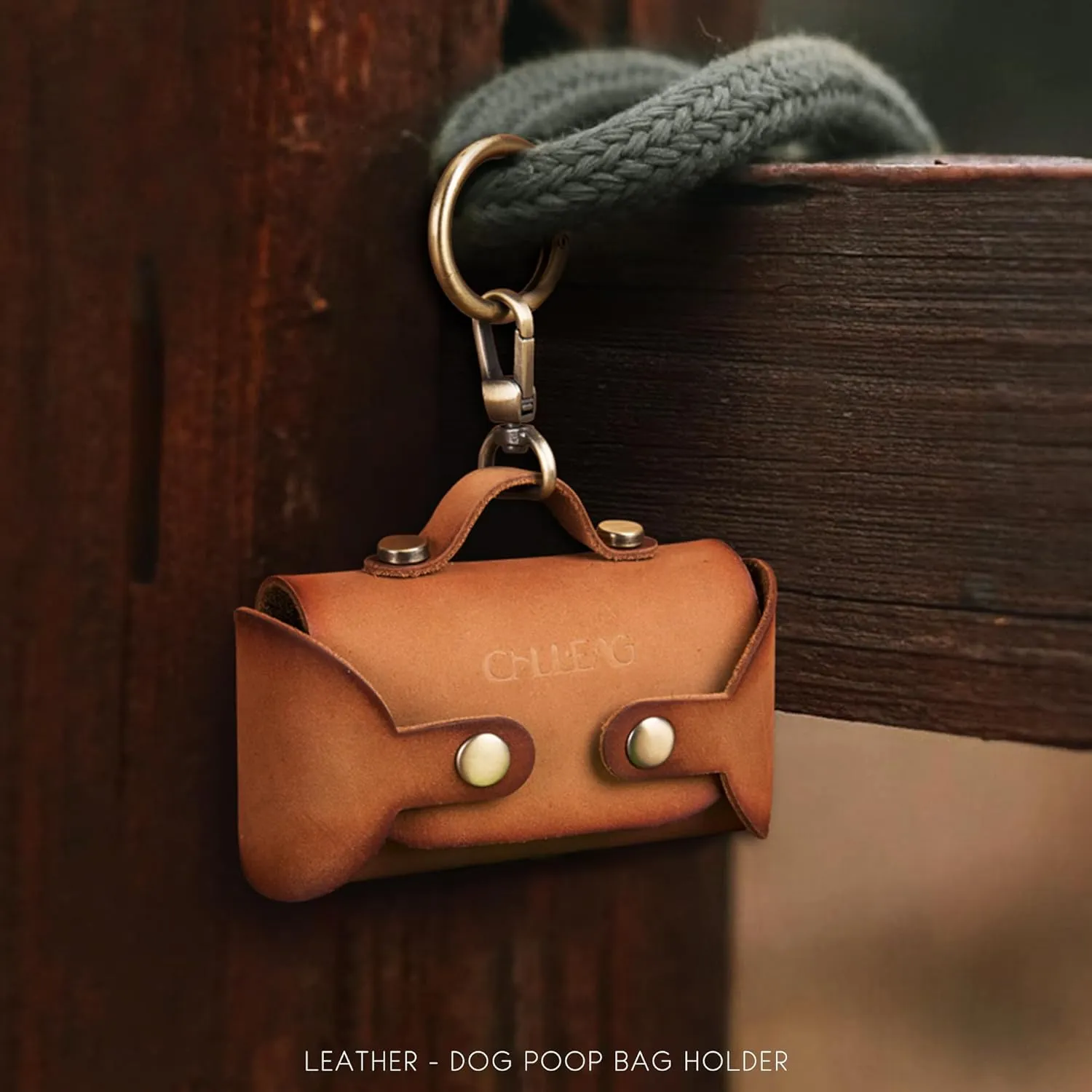 Handmade Leather Dog Poop Bag Dispenser - Stylish and Durable with Belt Attachment for Dog Walkers, Featuring a Brass Metal Clip in Hand-dyed Brown